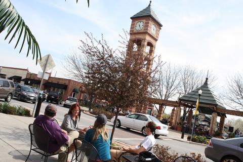 Group sitting outside in downtown Overland Park, Kan.