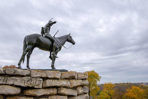 KC Scout statue on a cloudy day