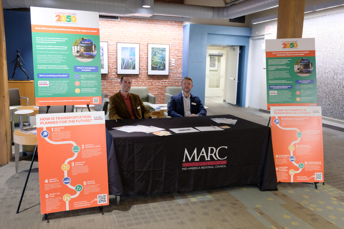 Check-in table with two people at the Connected KC 2050 public meeting