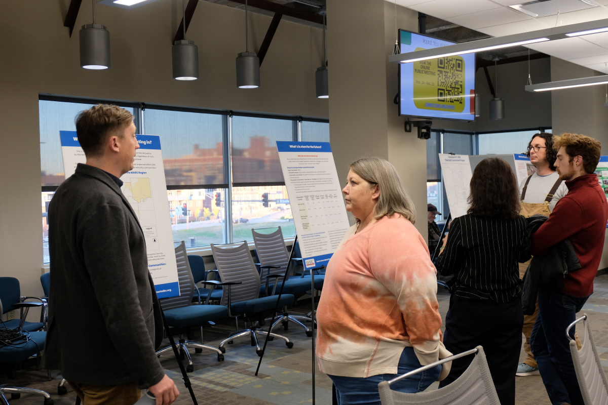 Check-in table with two people at the Connected KC 2050 public meeting