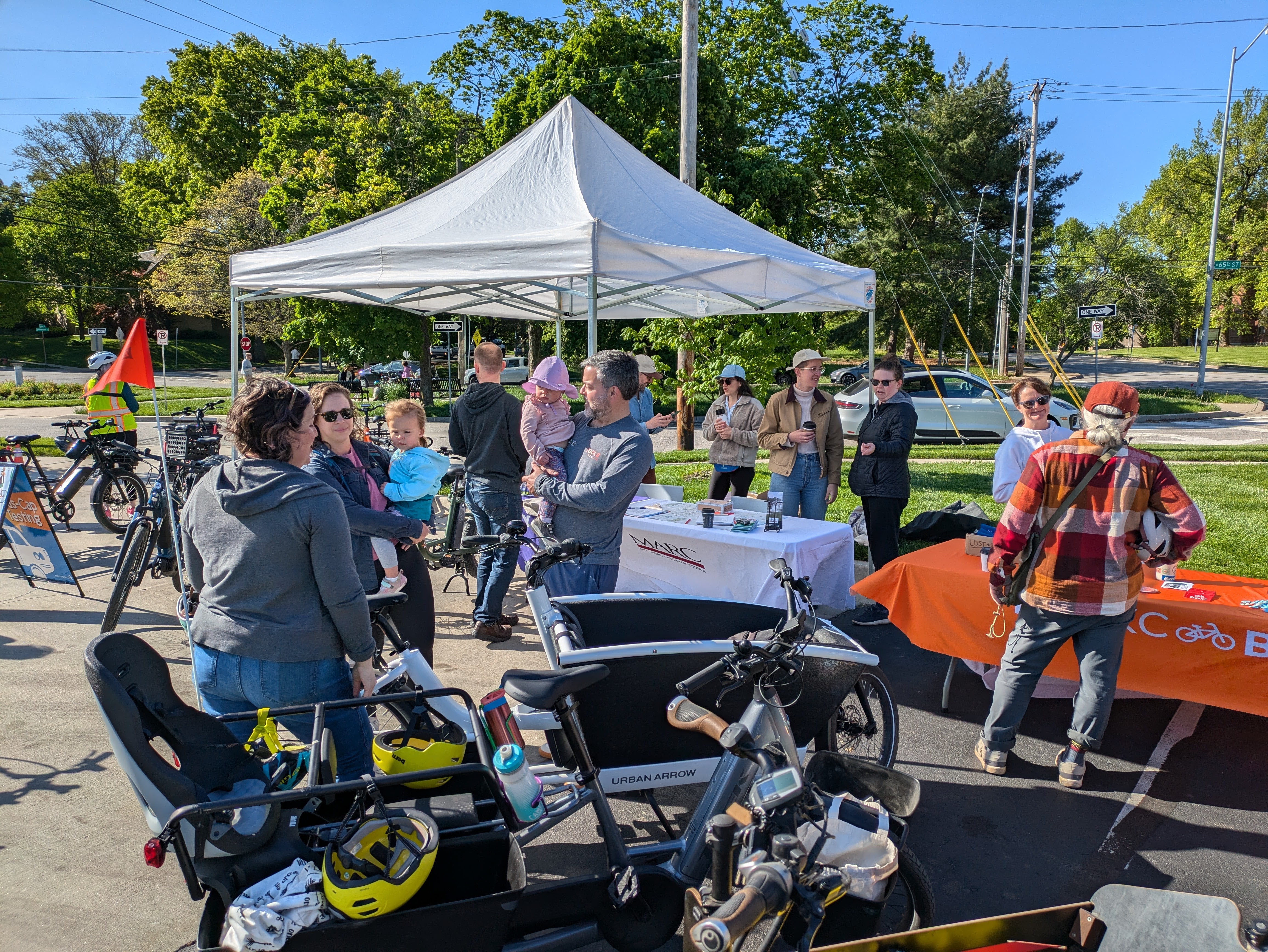 People looking at e-bikes during the E-Bike Petting Zoo