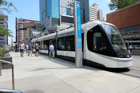 Streetcar stopped at Metro Center with pedestrians