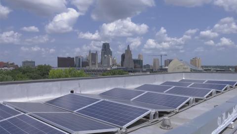 Kansas City skyline with solar panels in the foreground