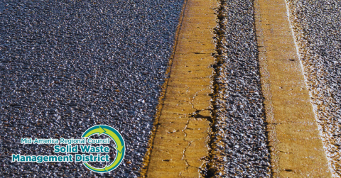 Two-lane asphalt with a yellow stripe and MARC SWMD logo