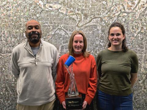 Plogtober winners pose with Natalie Unruh and the Plogtober trophy