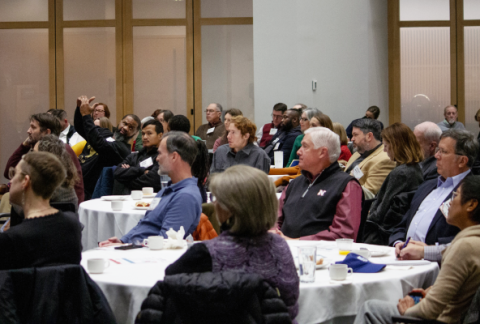 Attendees listening to a presenter during the Resilient Success Stories event