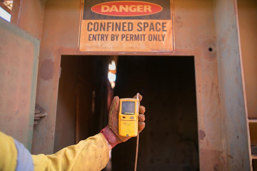 Confined Space - Entry by Permit Only sign at workplace