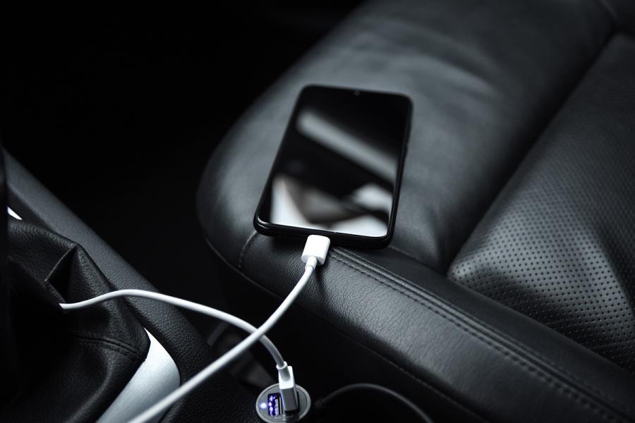 A phone charging inside a car