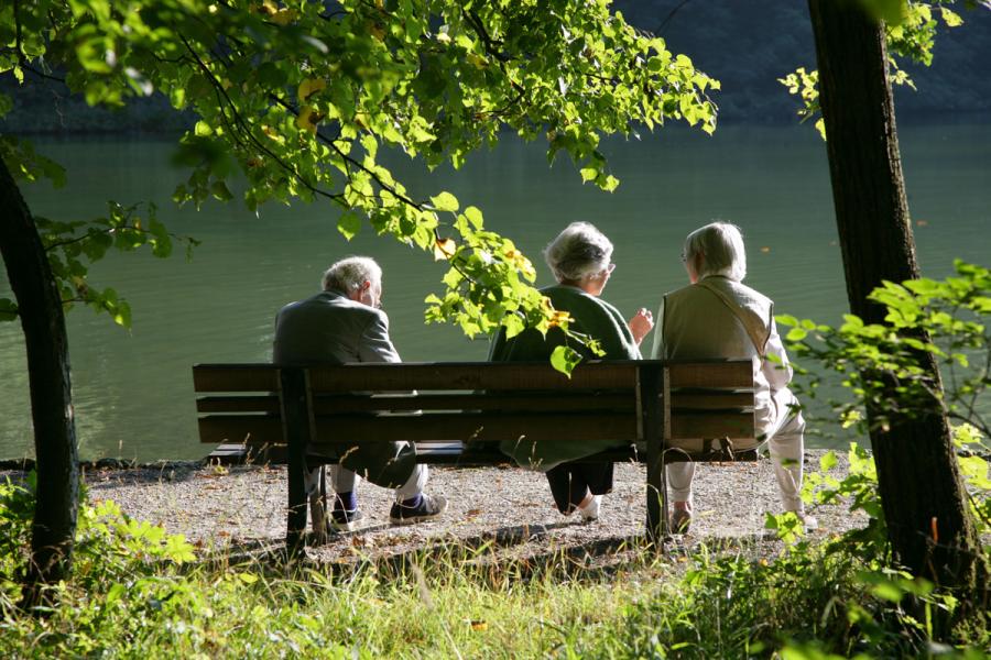 older adults on park benth