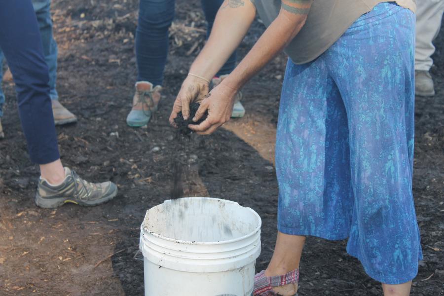 Hands on with compost material at Urbavore Urban Farm