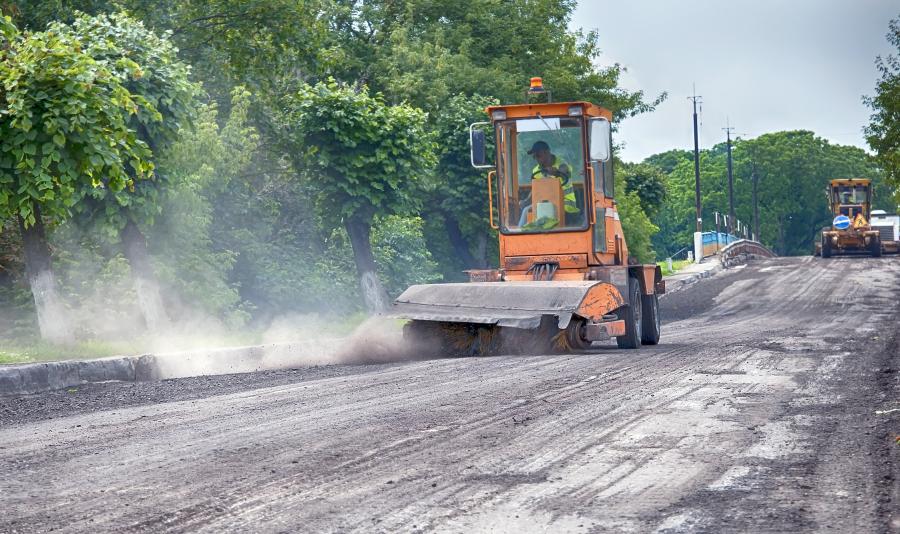 Road milling machine resurfacing road