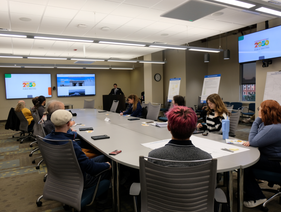 A room full of people viewing a presentation on the update to Connected KC 2050 by Martin Rivarola 