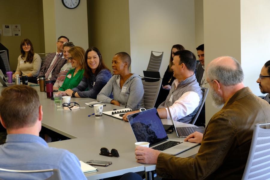 Collection of local leaders discuss topic in roundtable setting at MARC office